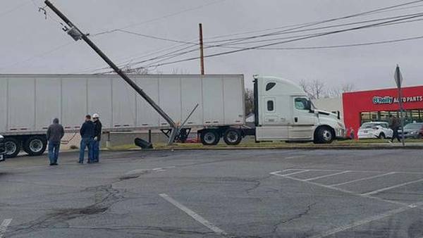 Semi-truck crashes into local power pole, lane reopens 